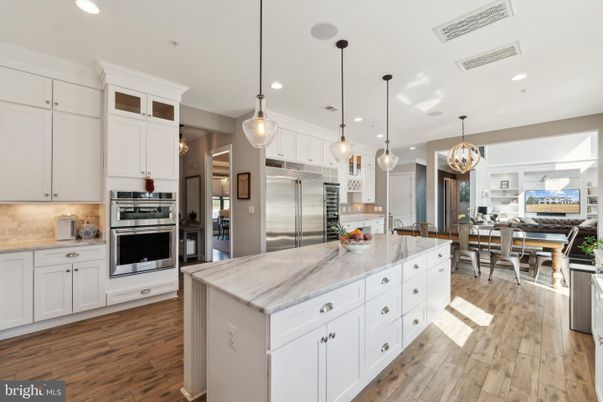 Chandelier, Dining room, Interior, Kitchen, Pendant Lights, Recessed Lighting, Stainless Steel Appliances, Wood Texture Flooring