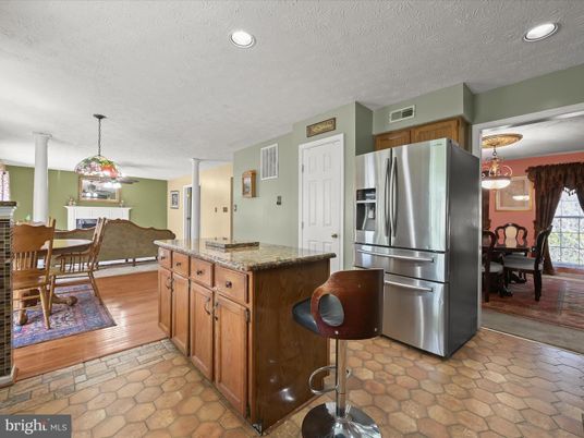 Chandelier, Dining room, Interior, Kitchen, Pendant Lights, Recessed Lighting, Stainless Steel Appliances, Wood Texture Flooring