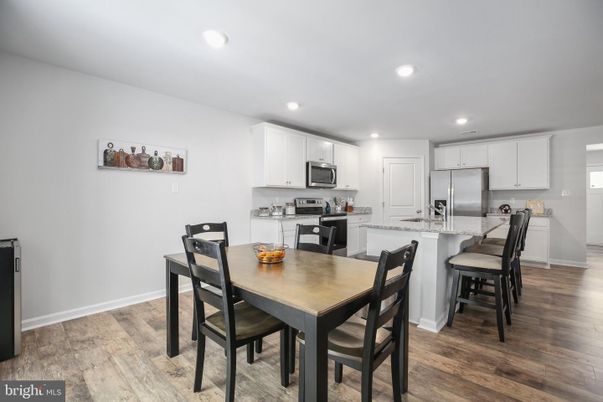 Dining room, Interior, Kitchen, Recessed Lighting, Stainless Steel Appliances, Wood Texture Flooring