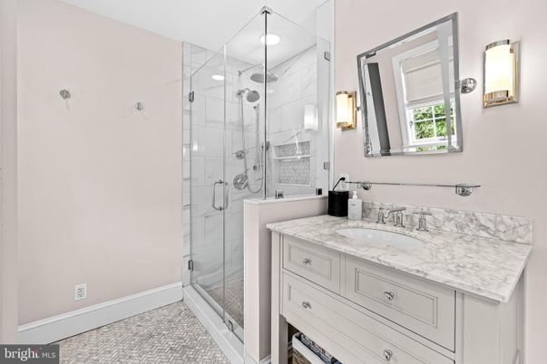 Bathroom, Dual Sink Vanities, Glass Shower, Interior, Marble Walls, Recessed Lighting
