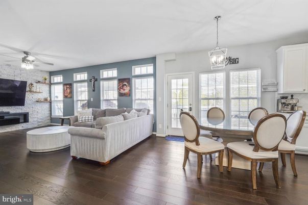 Dining room, Fireplace, Interior, Living room, Pendant Lights, Stone Walls, Wood Texture Flooring