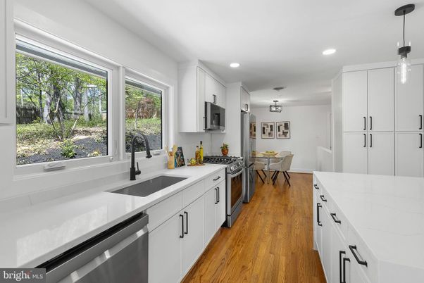Dining room, Interior, Kitchen, Pendant Lights, Recessed Lighting, Stainless Steel Appliances, Wood Texture Flooring