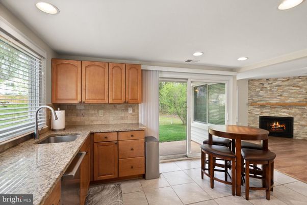 Dining room, Fireplace, Interior, Kitchen, Recessed Lighting, Stone Walls, Wood Texture Flooring