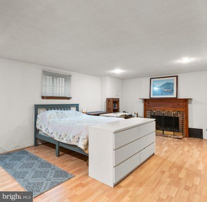 Bedroom, Fireplace, Interior, Recessed Lighting, Wood Texture Flooring