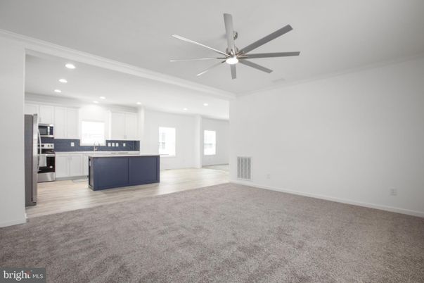 Empty room, Interior, Kitchen, Recessed Lighting, Stainless Steel Appliances, Wood Texture Flooring