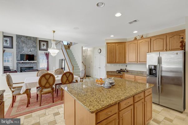 Chandelier, Dining room, Fireplace, Interior, Kitchen, Pendant Lights, Recessed Lighting, Stainless Steel Appliances