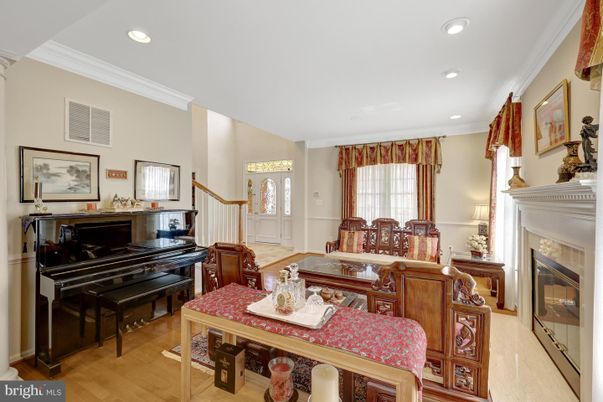Fireplace, Interior, Living room, Piano, Recessed Lighting, Wood Texture Flooring