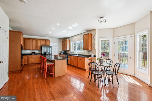 Dining room, Interior, Kitchen, Recessed Lighting, Stainless Steel Appliances, Wood Texture Flooring
