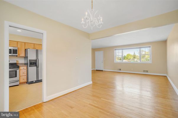 Chandelier, Empty room, Interior, Kitchen, Recessed Lighting, Stainless Steel Appliances, Wood Texture Flooring