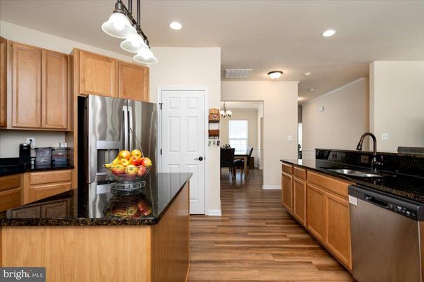 Chandelier, Dining room, Interior, Kitchen, Recessed Lighting, Stainless Steel Appliances, Wood Texture Flooring