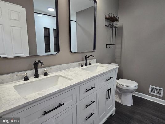 Bathroom, Dual Sink Vanities, Interior, Recessed Lighting, Wood Texture Flooring