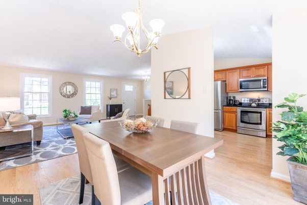 Chandelier, Dining room, Interior, Kitchen, Living room, Stainless Steel Appliances, Wood Texture Flooring