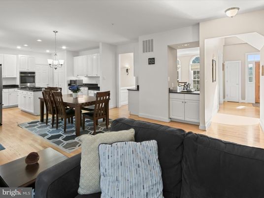 Chandelier, Dining room, Interior, Kitchen, Living room, Pendant Lights, Recessed Lighting, Stainless Steel Appliances, Wood Texture Flooring