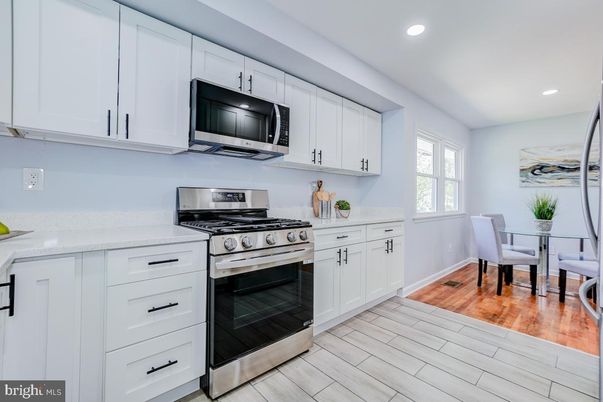 Dining room, Interior, Kitchen, Recessed Lighting, Stainless Steel Appliances, Wood Texture Flooring