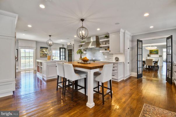 Chandelier, Dining room, Interior, Kitchen, Pendant Lights, Recessed Lighting, Stainless Steel Appliances, Wood Texture Flooring