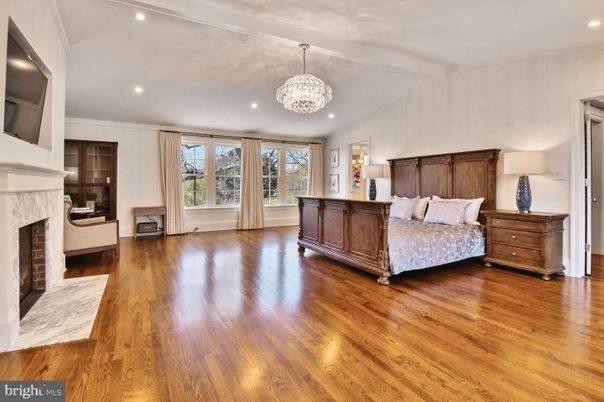 Bedroom, Chandelier, Fireplace, Interior, Recessed Lighting, Wood Texture Flooring