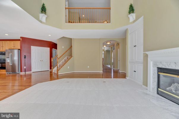 Fireplace, Interior, Kitchen, Recessed Lighting, Stainless Steel Appliances, Wood Texture Flooring