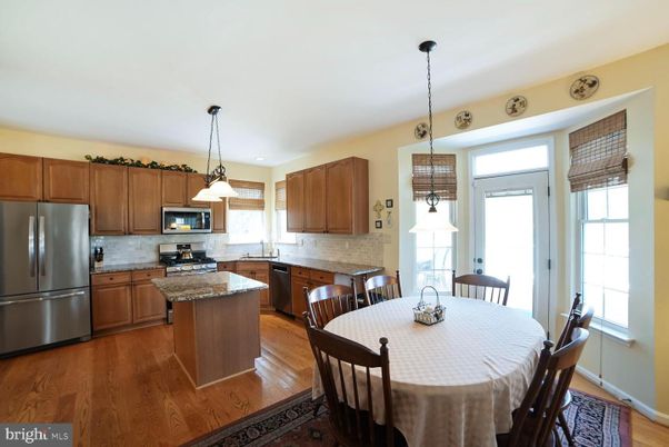 Dining room, Interior, Kitchen, Pendant Lights, Stainless Steel Appliances, Wood Texture Flooring