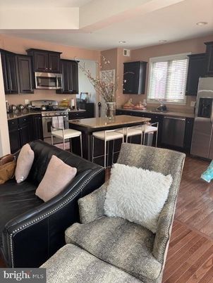 Dining room, Interior, Kitchen, Living room, Recessed Lighting, Stainless Steel Appliances, Wood Texture Flooring