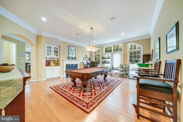 Billiard Table, Chandelier, Fireplace, Game Room, Interior, Pendant Lights, Recessed Lighting, Wood Texture Flooring