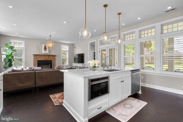 Fireplace, Interior, Kitchen, Living room, Pendant Lights, Recessed Lighting, Stainless Steel Appliances, Wood Texture Flooring