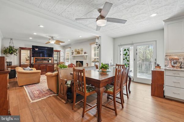 Dining room, Fireplace, Interior, Living room, Recessed Lighting, Wood Texture Flooring