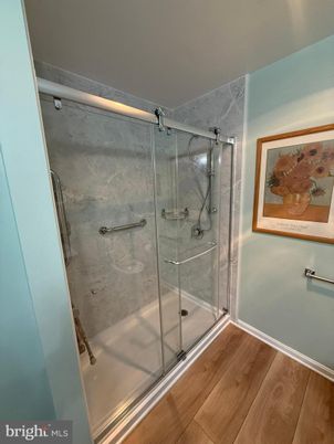 Bathroom, Glass Shower, Interior, Marble Walls, Wood Texture Flooring