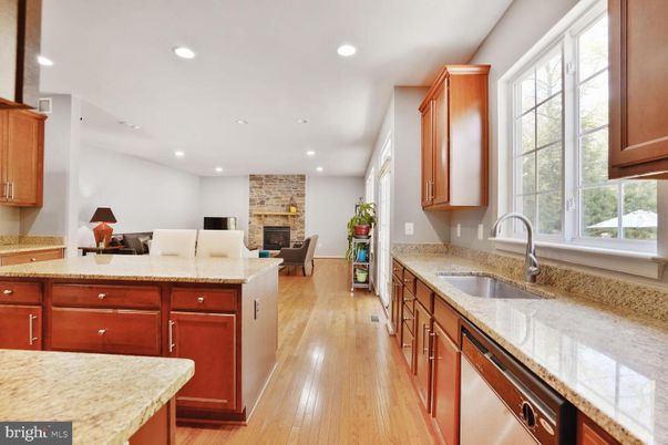 Fireplace, Interior, Kitchen, Recessed Lighting, Stone Walls, Wood Texture Flooring