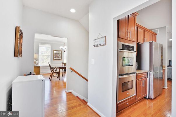 Chandelier, Dining room, Interior, Kitchen, Recessed Lighting, Stainless Steel Appliances, Wood Texture Flooring