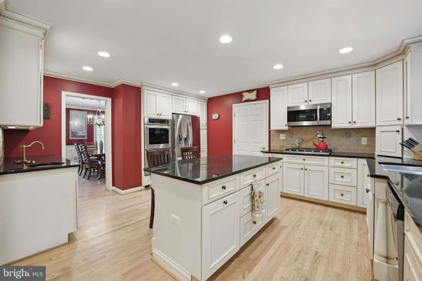 Chandelier, Dining room, Interior, Kitchen, Recessed Lighting, Stainless Steel Appliances, Wood Texture Flooring