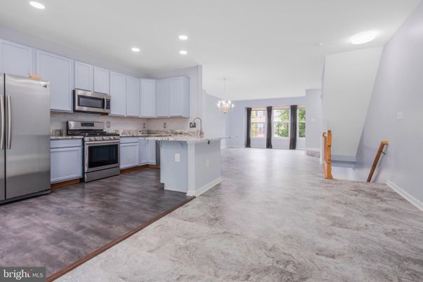 Chandelier, Interior, Kitchen, Recessed Lighting, Stainless Steel Appliances, Wood Texture Flooring