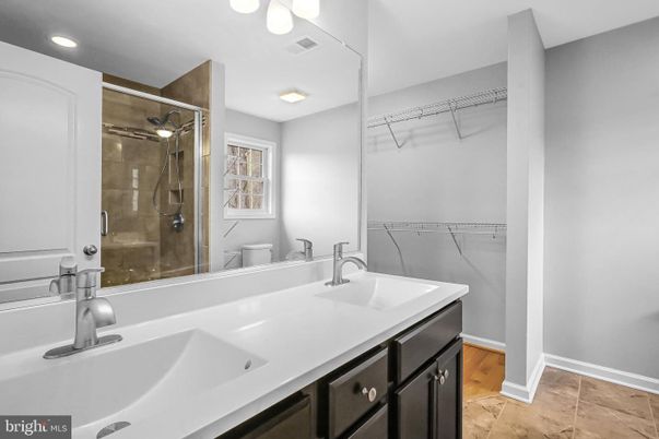 Bathroom, Dual Sink Vanities, Glass Shower, Interior, Recessed Lighting, Walk-in Closets