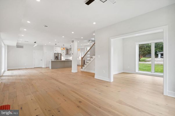 Empty room, Interior, Kitchen, Pendant Lights, Recessed Lighting, Stainless Steel Appliances, Wood Texture Flooring