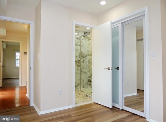 Bathroom, Glass Shower, Interior, Marble, Marble Walls, Recessed Lighting, Wood Texture Flooring