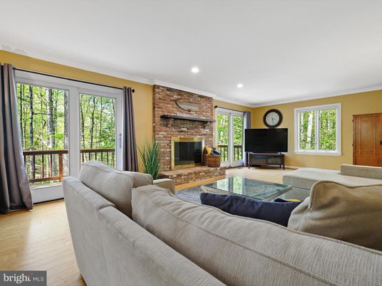 Fireplace, Interior, Living room, Recessed Lighting, Stone Walls, Wood Texture Flooring