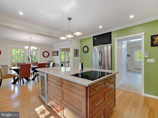 Chandelier, Dining room, Interior, Kitchen, Pendant Lights, Recessed Lighting, Stainless Steel Appliances, Wood Texture Flooring