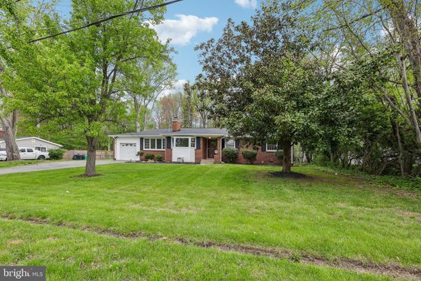 Attached, Backyard, Exterior, Facade, Brick Facade, Cape Cod
