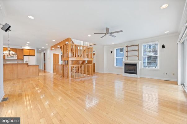 Empty room, Fireplace, Interior, Kitchen, Pendant Lights, Recessed Lighting, Wood Texture Flooring