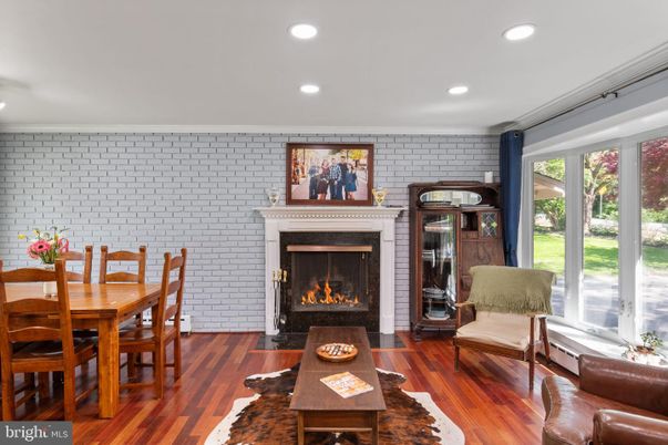 Dining room, Fireplace, Interior, Living room, Recessed Lighting, Stone Walls, Wood Texture Flooring