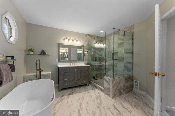 Bathroom, Dual Sink Vanities, Free Standing Baths, Glass Shower, Interior, Marble, Recessed Lighting