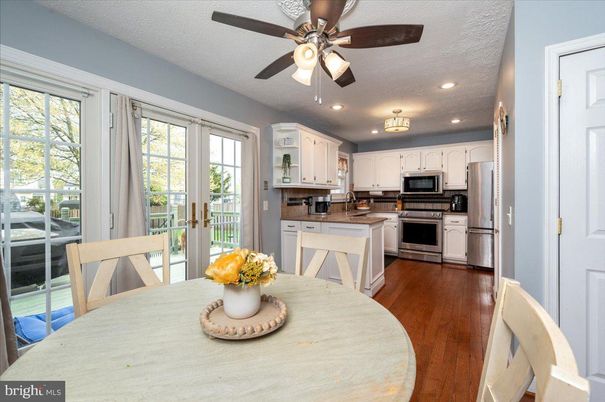 Dining room, Interior, Kitchen, Recessed Lighting, Stainless Steel Appliances, Wood Texture Flooring