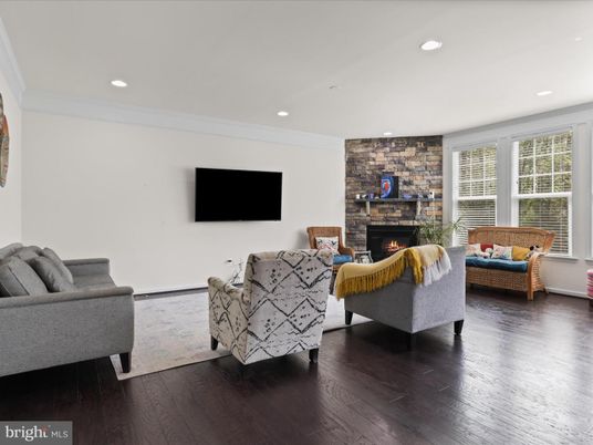 Fireplace, Interior, Living room, Recessed Lighting, Stone Walls, Wood Texture Flooring
