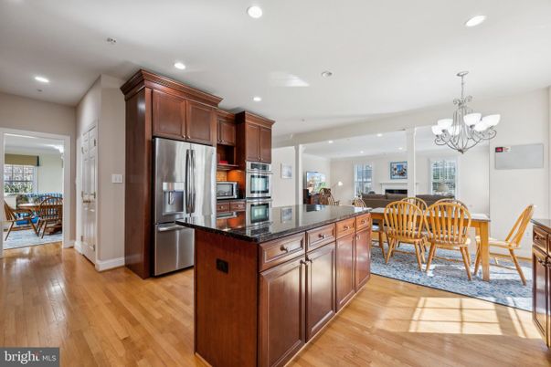 Chandelier, Dining room, Interior, Kitchen, Recessed Lighting, Stainless Steel Appliances, Wood Texture Flooring