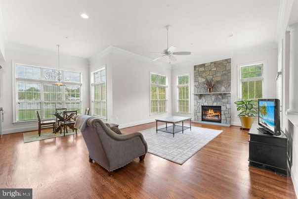 Dining room, Fireplace, Interior, Living room, Pendant Lights, Recessed Lighting, Stone Walls, Wood Texture Flooring