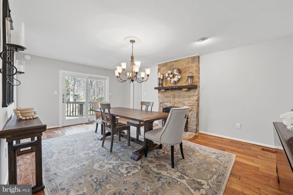 Chandelier, Dining room, Fireplace, Interior, Stone Walls, Wood Texture Flooring