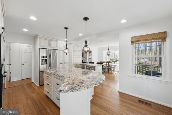Chandelier, Dining room, Interior, Kitchen, Pendant Lights, Recessed Lighting, Stainless Steel Appliances, Wood Texture Flooring
