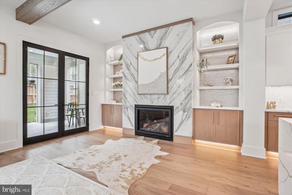 Fireplace, Interior, Marble Walls, Recessed Lighting, Wood Texture Flooring