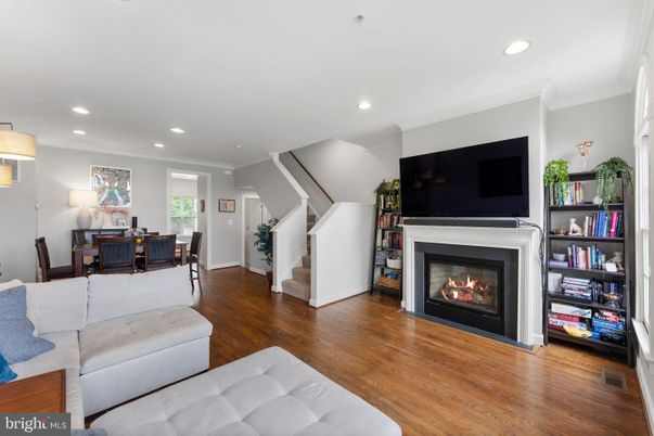 Dining room, Fireplace, Interior, Living room, Recessed Lighting, Wood Texture Flooring