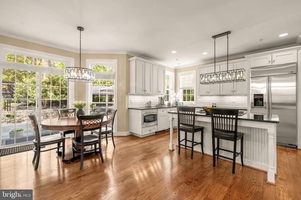 Chandelier, Dining room, Interior, Kitchen, Pendant Lights, Recessed Lighting, Stainless Steel Appliances, Wood Texture Flooring