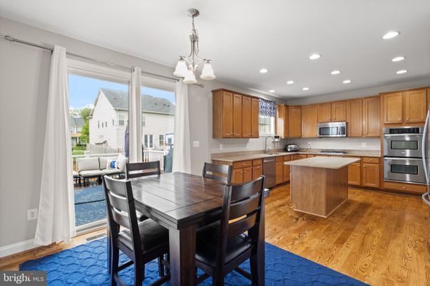 Dining room, Interior, Kitchen, Pendant Lights, Recessed Lighting, Stainless Steel Appliances, Wood Texture Flooring